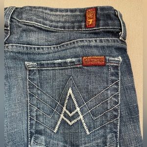 7 for All Man Kind low rise flare jeans size 27 medium wash